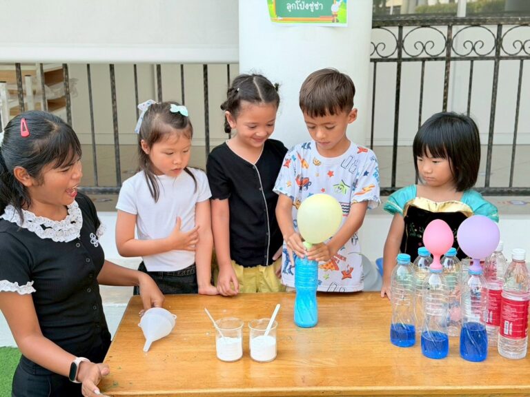 Students doing a hands-on science experiment with balloons