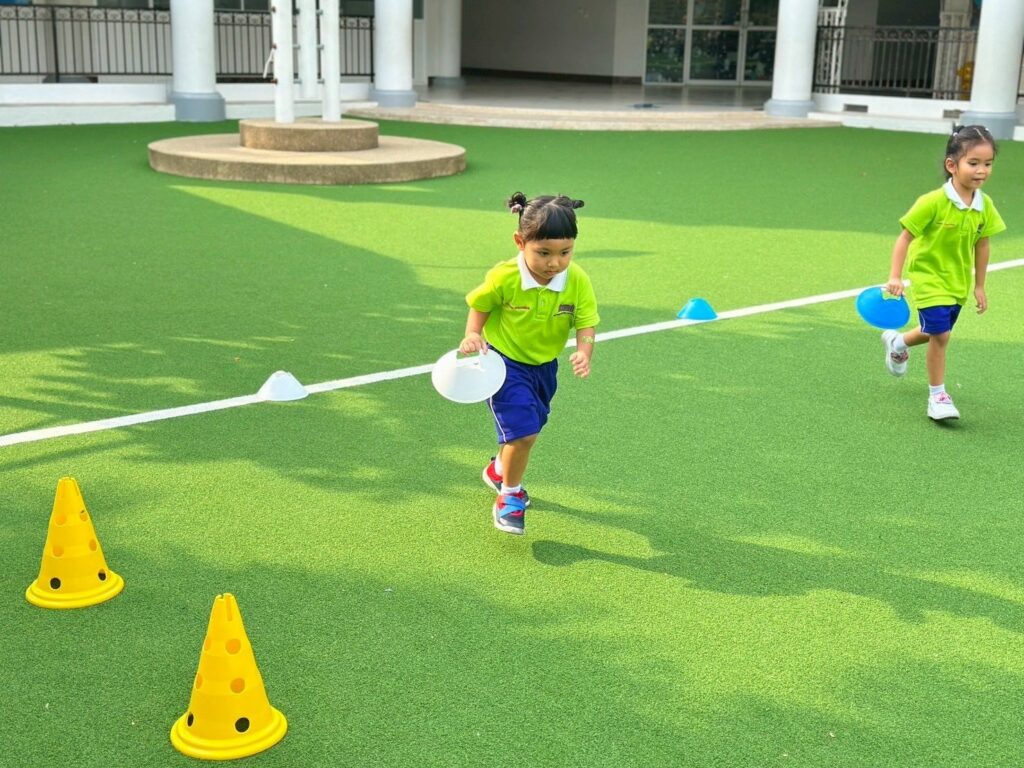 Student dribbling a basketball during sports practice